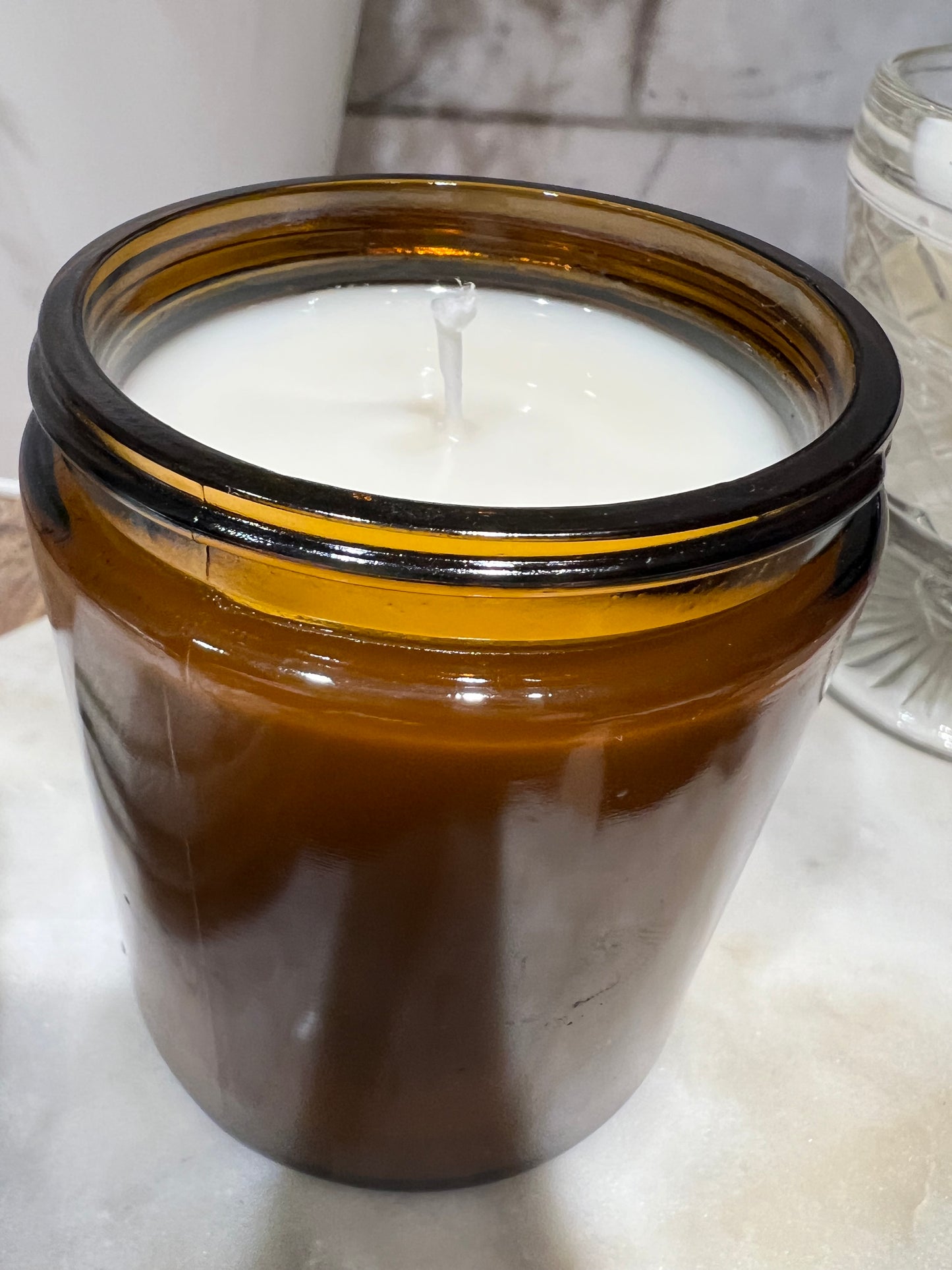 8 ounce candle in amber glass jar with lid